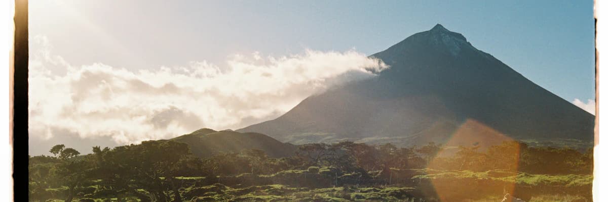 Majestic Pico volcano landscape with green pastures, Azores